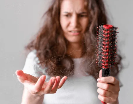 Hair fall on a hairbrush